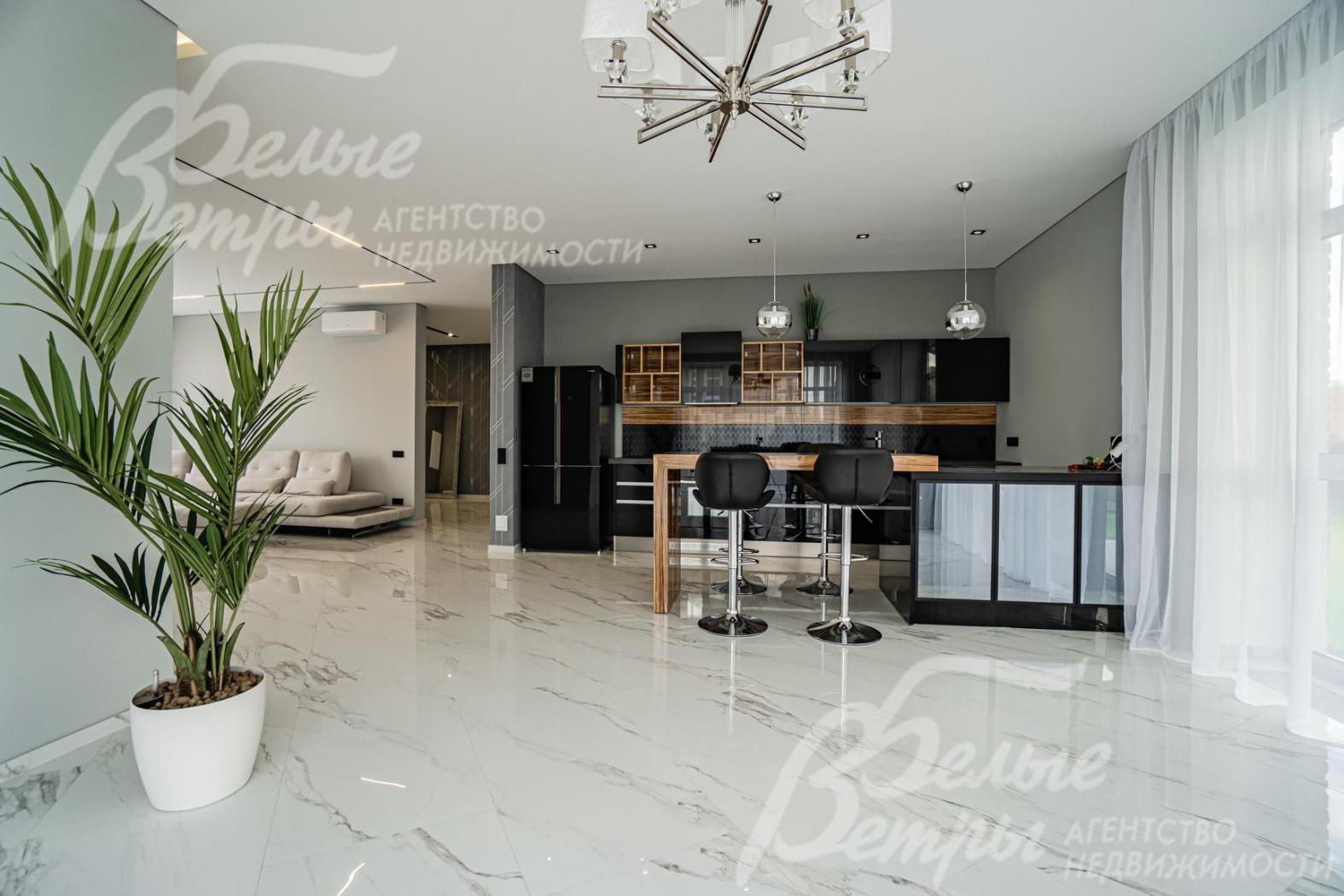 На кухне новая мебель с функциональным островом - стекло от студии Giulia Novars со столешницей - керамика, барная стойка - палисандр 