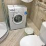 Стиральная машина "BEKO" в санузле